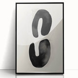 Framed abstract minimalist wall art featuring a sleek black design, showcasing elegant lines and shapes, perfect for modern home decor and aesthetic enhancement.