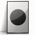 Framed abstract minimalist wall art featuring a sleek black acrylic front, perfect for modern decor, displayed against a neutral backdrop for elegant styling.