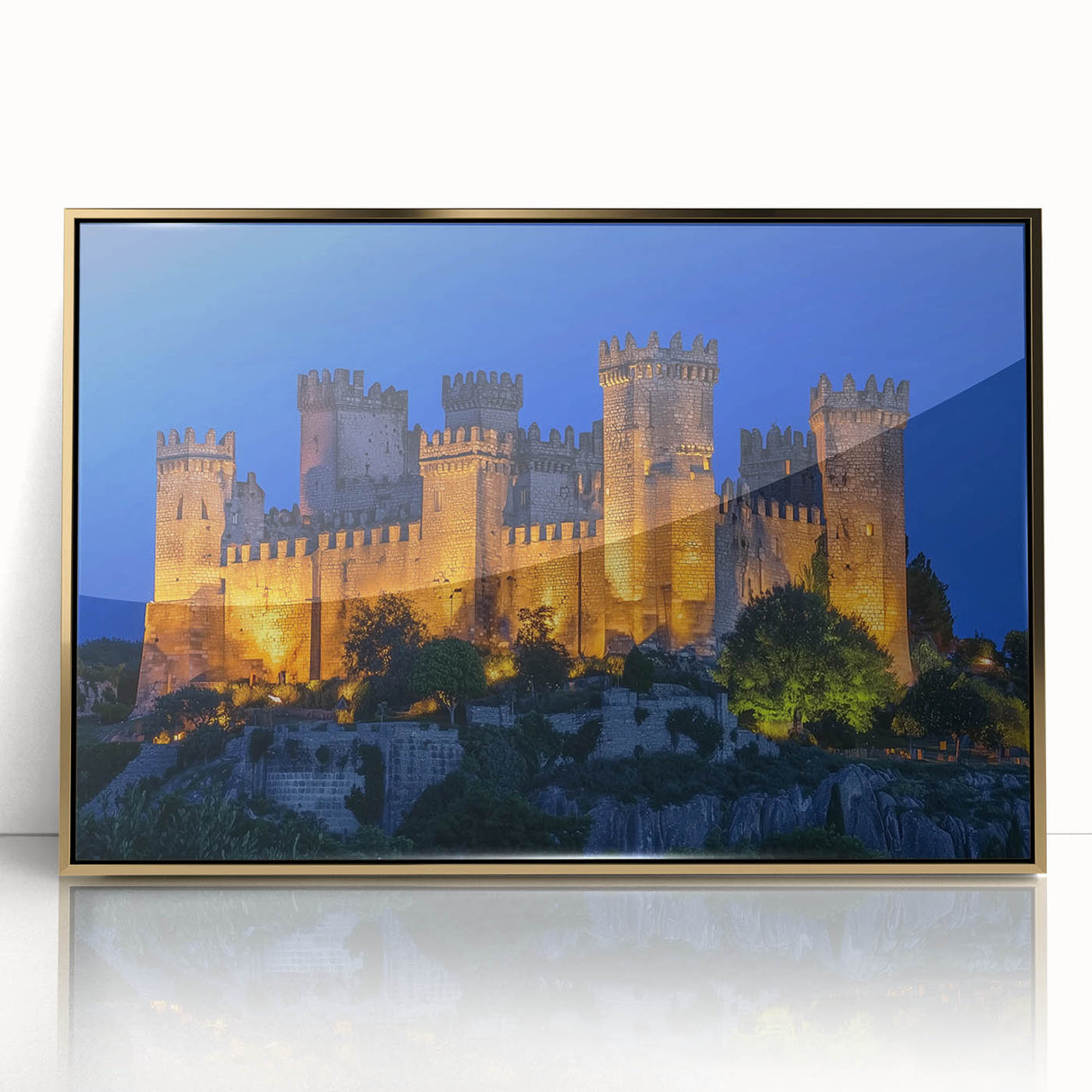 Framed acrylic artwork showcasing a picturesque landscape with a castle, highlighted by a luxurious gold frame, ideal for elegant home decor.