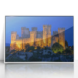 Framed acrylic artwork showcasing a vibrant landscape with a majestic castle under a clear blue sky, set in a sleek white frame, perfect for home decor.