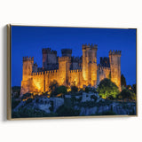Framed canvas artwork of a picturesque castle landscape, featuring intricate details and a gold frame, showcasing a side view against a neutral background.