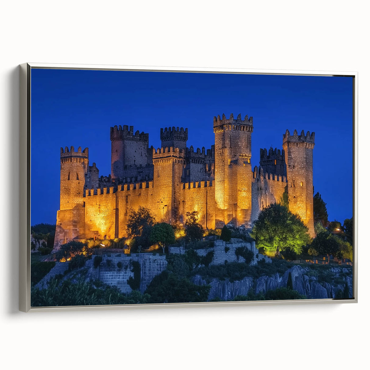 Framed canvas artwork depicting a serene landscape with a castle, featuring a silver frame and a side view that highlights its elegant design, perfect for home decor.