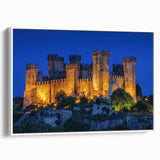 Framed canvas artwork showcasing a picturesque landscape with a medieval castle, featuring vibrant colors and intricate details, set against a white background for a modern aesthetic.