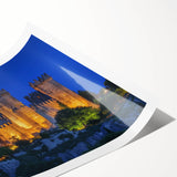 Rolled print showcasing a vibrant landscape with a majestic castle set against a dramatic sky, designed for home decor, elegantly packaged in a protective tube.