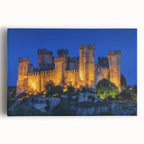 Stretched canvas artwork depicting a vibrant landscape with a majestic castle, surrounded by lush greenery and a clear blue sky, perfect for home decor.