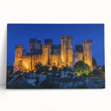 Stretched canvas artwork depicting a scenic landscape with a majestic castle surrounded by lush greenery and a vibrant blue sky, ideal for home decor.
