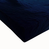 Close-up of a stretched canvas artwork depicting a vibrant landscape with caves, showcasing intricate details and rich colors, ideal for home decor.