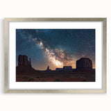 Framed landscape artwork depicting dramatic cliffs under a clear blue sky, featuring a silver mat border for an elegant presentation, ideal for home decor.