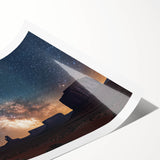 Stunning landscape print of cliffs at sunset, showcasing vibrant orange and purple hues, rolled and secured in a protective cardboard tube for easy display.