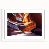 Landscape artwork featuring a canyon scene in a white frame with a mat, showcasing vibrant colors and intricate details, perfect for home decor enhancement.