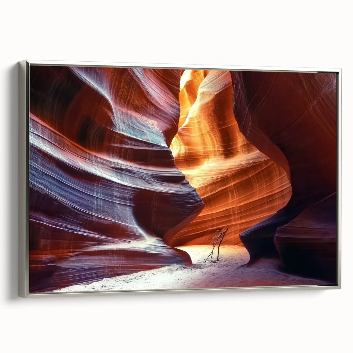 Framed canvas artwork depicting a stunning landscape of canyons, showcasing vibrant colors and intricate details. The piece features a sleek silver frame, enhancing its modern aesthetic, perfect for home décor.