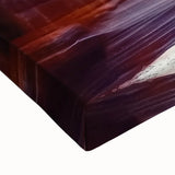 Close-up of a stretched canvas artwork depicting vibrant landscape canyons with intricate detail, showcasing earthy tones and textures, perfect for home decor.