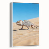 Framed canvas art depicting a vibrant desert landscape with warm hues of orange and yellow, showcasing a modern design. The artwork is presented in a sleek white frame, ideal for enhancing contemporary home decor.