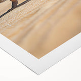 Desert landscape rolled canvas artwork showcasing vibrant hues of orange and yellow, depicting a serene sunset over sand dunes, ideal for home decor.