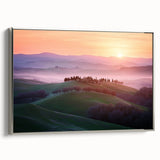 Framed canvas artwork depicting vibrant, abstract landscape fields in rich greens and blues, featuring a sleek silver frame that enhances its modern aesthetic.
