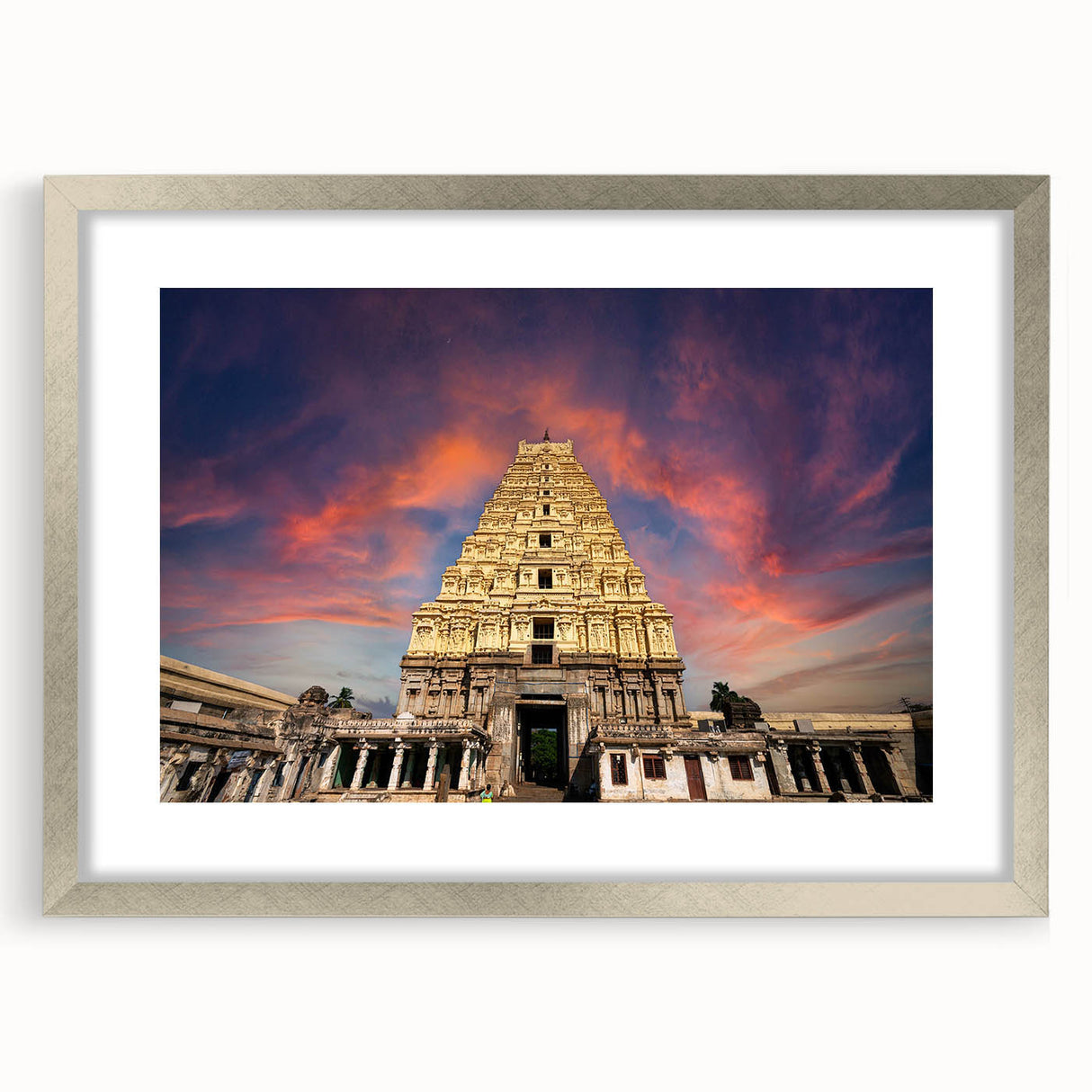 Textured art print of an abstract Indian landscape in muted earth tones, framed in silver, ideal for bedroom art.