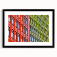 Colorful abstract art print of London scenery in vibrant hues, framed in black, suitable for living room decor.