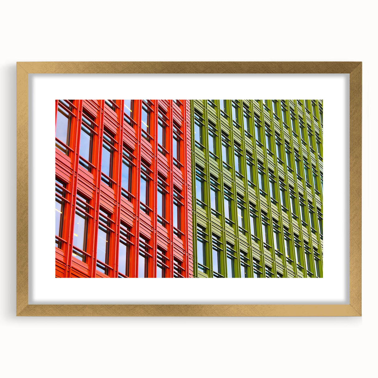 Abstract art print of London scenery in muted gold and blue tones, framed with a gold mat, suitable for dining room decor.