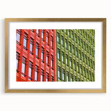 Abstract art print of London scenery in muted gold and blue tones, framed with a gold mat, suitable for dining room decor.