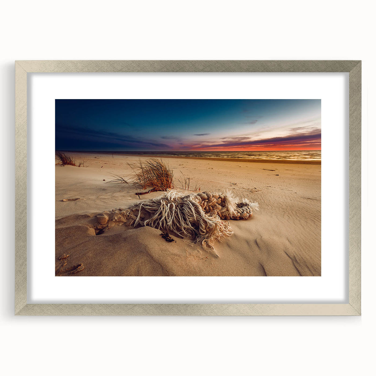 Extra large abstract art print depicting a textured European landscape in muted earth tones, framed in silver.