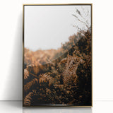 Large art print of a mid-century modernist autumn scene in gold and orange tones, framed acrylic.