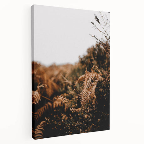 Side view of a large stretched canvas featuring a fall-themed abstract design in warm orange and red tones.