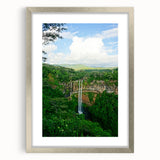 Textured art depicting abstract spring theme in muted green and yellow tones on a silver-framed canvas.