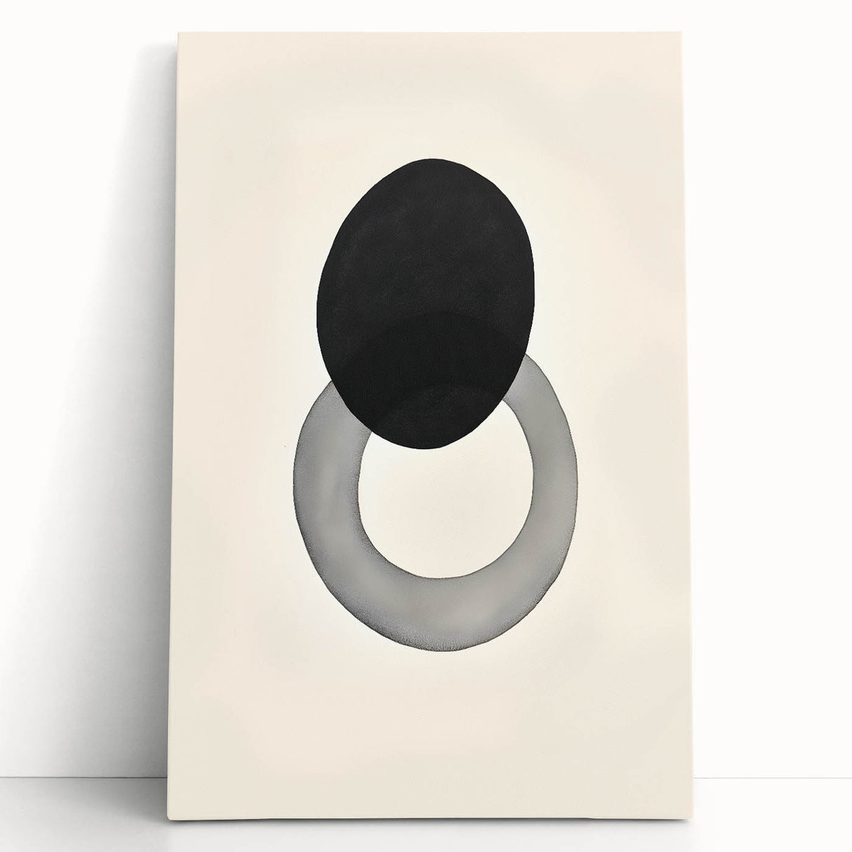 Abstract minimalist wall art on a stretched canvas, featuring soft pastel colors and geometric shapes, leaning against a white wall, ideal for modern decor.