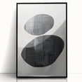 Framed abstract minimalist wall art featuring a sleek black acrylic design, set against a light background, ideal for modern home decor and artistic spaces.