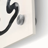 Close-up of an abstract minimalist wall art design featuring soft earth tones and geometric shapes, printed on acrylic glass with a sleek finish for modern decor.