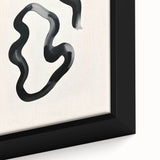 Close-up of an abstract minimalist wall art piece framed in a sleek black frame, showcasing soft pastel colors and geometric shapes, ideal for modern decor.