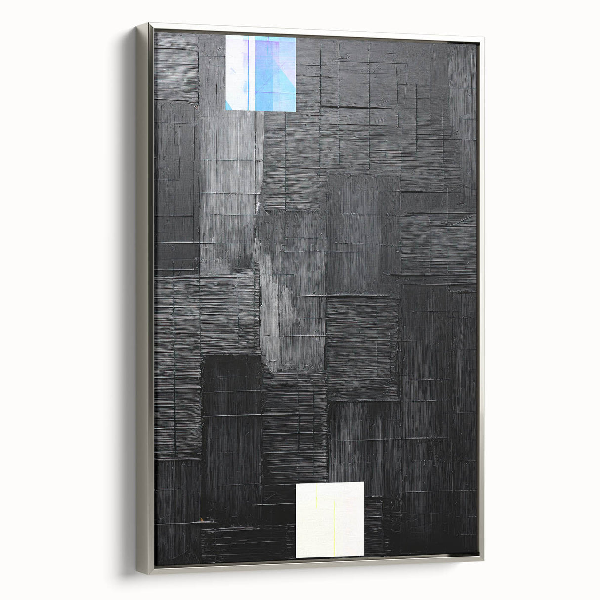 Framed abstract minimalist wall art in silver showcasing geometric shapes and subtle textures, ideal for modern home decor, viewed from the side.