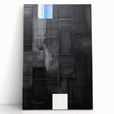 Abstract minimalist wall art on stretched canvas, featuring soft earth tones and geometric shapes, leaning against a neutral wall, ideal for modern decor.