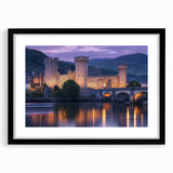 Elegant black-framed landscape artwork featuring a majestic castle surrounded by lush greenery, displayed with a white mat for a refined presentation. Perfect for home decor enthusiasts seeking a touch of sophistication.