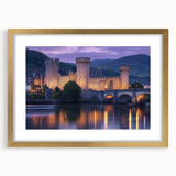 Gold-framed landscape artwork depicting a serene castle scene, elegantly matted for enhanced presentation, ideal for home décor and art enthusiasts.