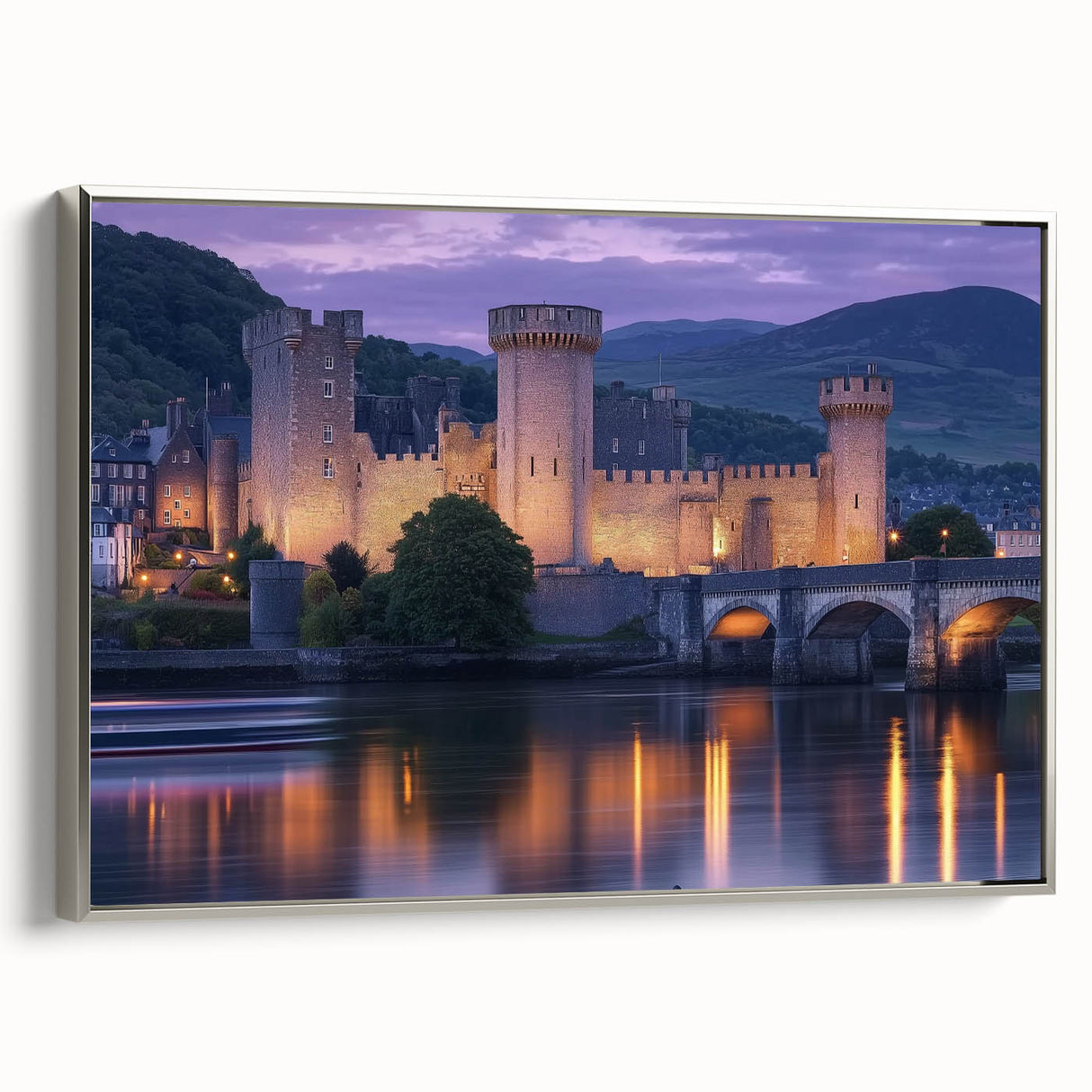 Framed canvas artwork depicting a serene landscape with a castle, featuring a silver frame and showcasing intricate details, ideal for home decor.