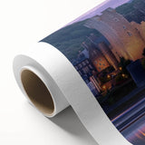 Landscape canvas print showcasing a majestic castle surrounded by lush greenery under a clear blue sky. Perfect for home decor, this artwork adds an elegant touch to any room.