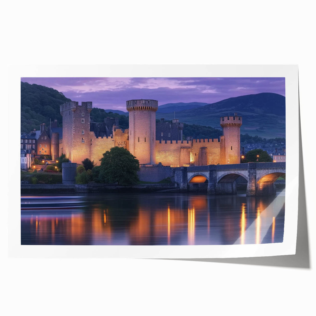Rolled print showcasing a beautiful landscape featuring a majestic castle surrounded by lush greenery and a clear blue sky, perfect for home decor.
