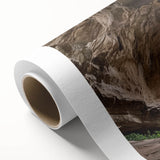 Rolled canvas print showcasing an intricate landscape design with caves, featuring vibrant colors and textures, perfect for home decor. Packaged securely in a durable tube for shipping.