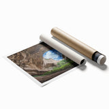 Rolled landscape print of vibrant cave scenery showcasing earthy tones and intricate textures, packaged securely in a protective cardboard tube for easy transport.