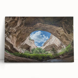 Stretched canvas artwork showcasing a vibrant landscape scene of caves and rock formations, featuring rich colors and intricate details, perfect for home decor.
