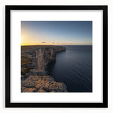 Framed black landscape artwork showcasing dramatic cliffs, elegantly matted for a sophisticated display. Perfect for modern home decor, adding depth and elegance to any room.