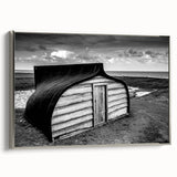 Framed canvas wall art depicting a rustic barn landscape scene, featuring silver accents on the frame, perfect for farmhouse or country decor enthusiasts.