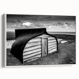 Framed landscape canvas wall art depicting a serene barn scene with vibrant colors, designed to enhance rustic home decor. The artwork features a white frame and is perfect for adding charm to living spaces.