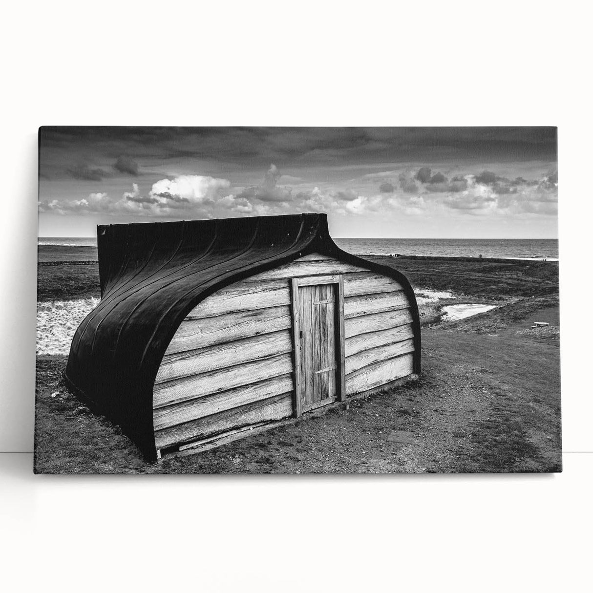 Stretched canvas artwork showcasing a serene landscape with a rustic barn, vibrant greens, and soft blues, perfect for enhancing home décor with a countryside charm.