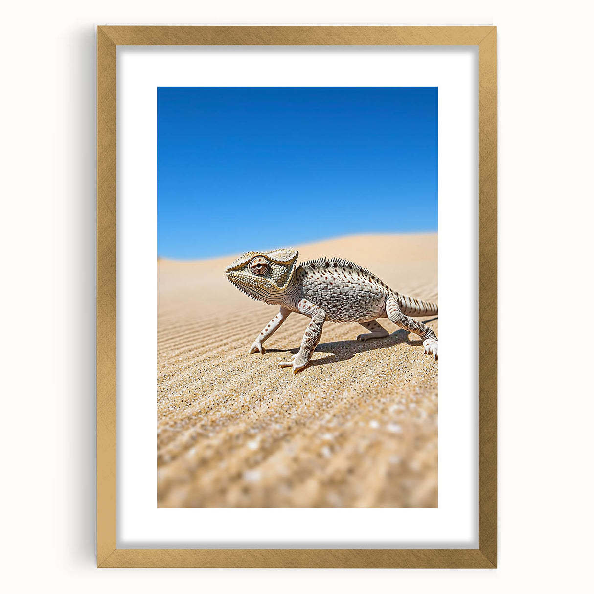 Desert landscape framed artwork with a gold mat, showcasing warm tones of sand and sunset hues, perfect for enhancing modern interior decor.