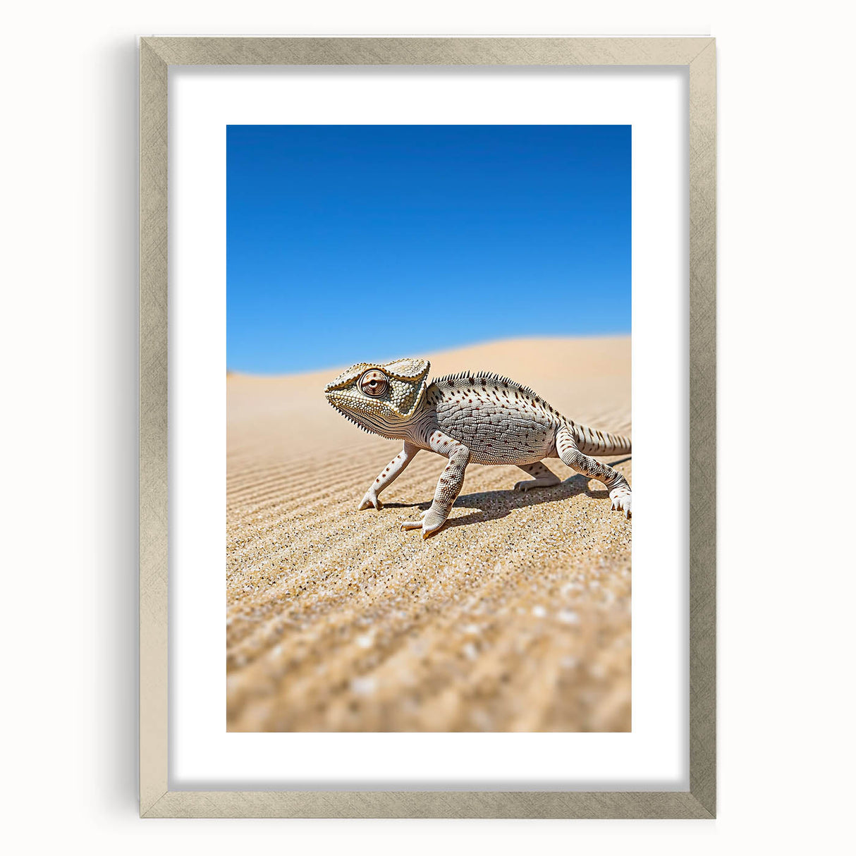 Framed desert landscape artwork with a silver mat, showcasing vibrant hues of orange and blue, perfect for enhancing modern home decor.