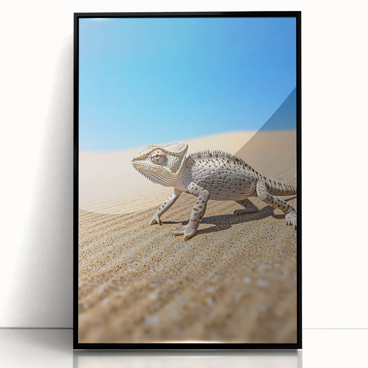 Framed acrylic artwork depicting a serene desert landscape, showcasing warm tones of orange and yellow against a black frame, ideal for modern home decor.