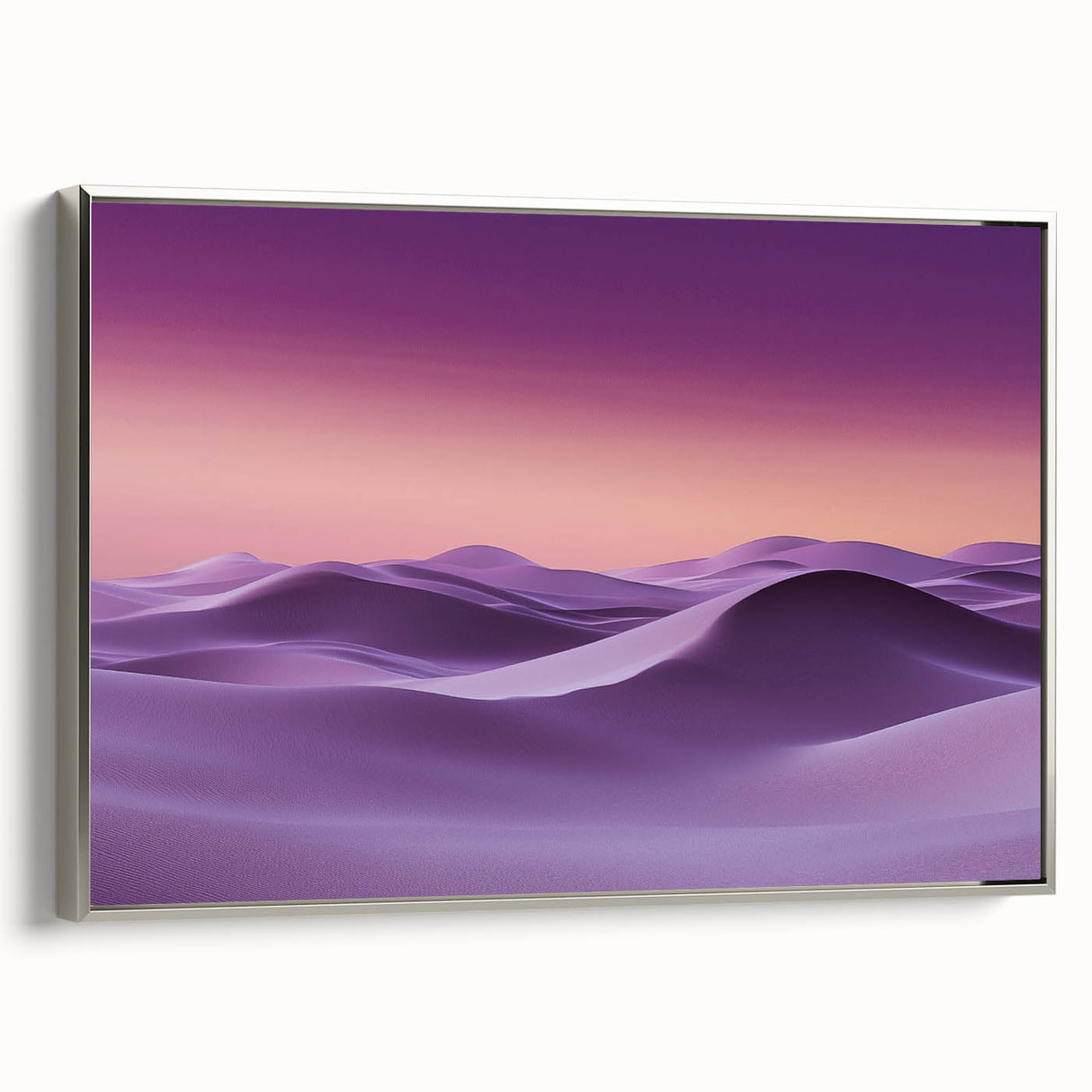 Framed canvas artwork depicting serene sand dunes under a vibrant sunset, featuring a silver frame that enhances the landscape's beauty, ideal for modern home decor.
