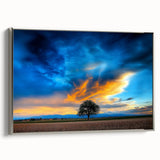 Framed canvas print showcasing a serene landscape with rolling fields and a silver border, ideal for home decor. The artwork features vibrant greens and earthy tones, enhancing any interior space.
